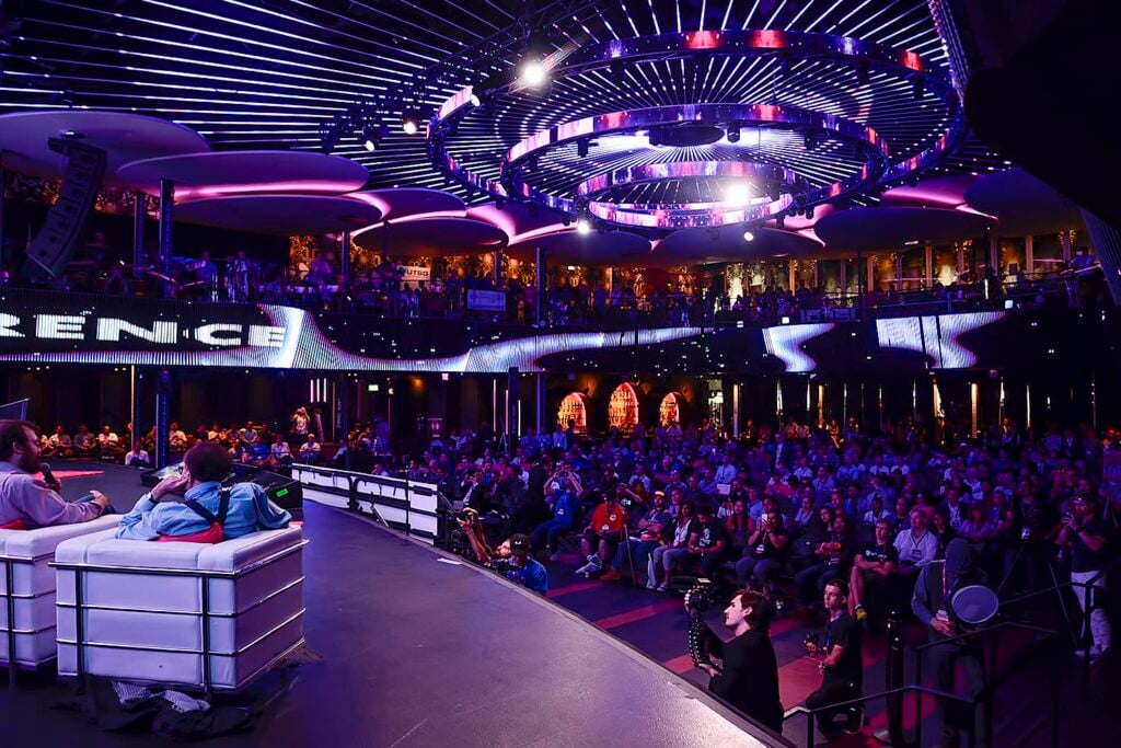 An audience is engaged in a presentation at The Blockchain Futurist Conference