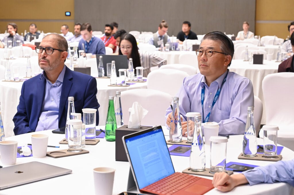 Participants listen intently during a session at the IEEE International Conference on Blockchain and Cryptocurrency