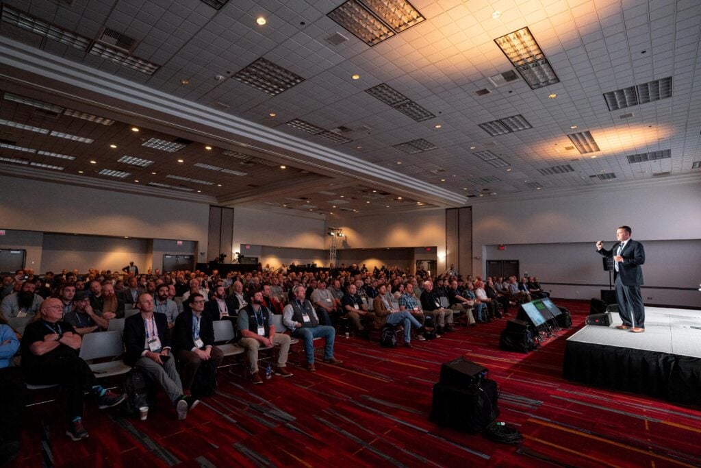A speaker and large audience in a conference hall of International Wireless Communications Expo